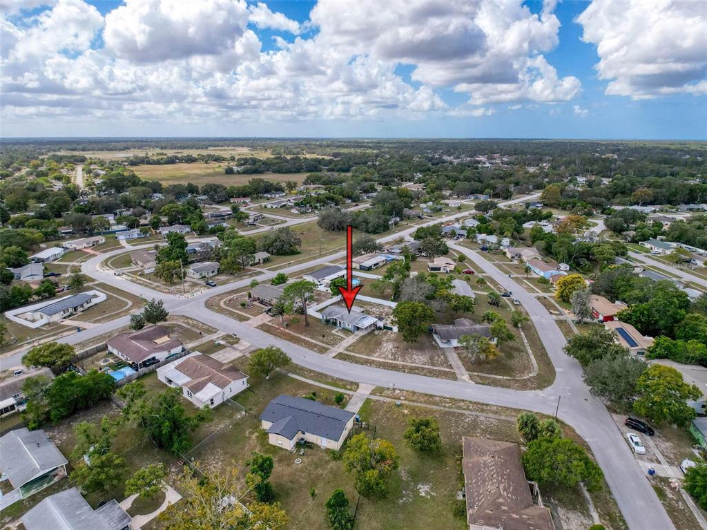 9381 Marler Road Spring Hill, FL 34608 - Photo 50 of 52 an aerial view of residential houses with outdoor space and trees