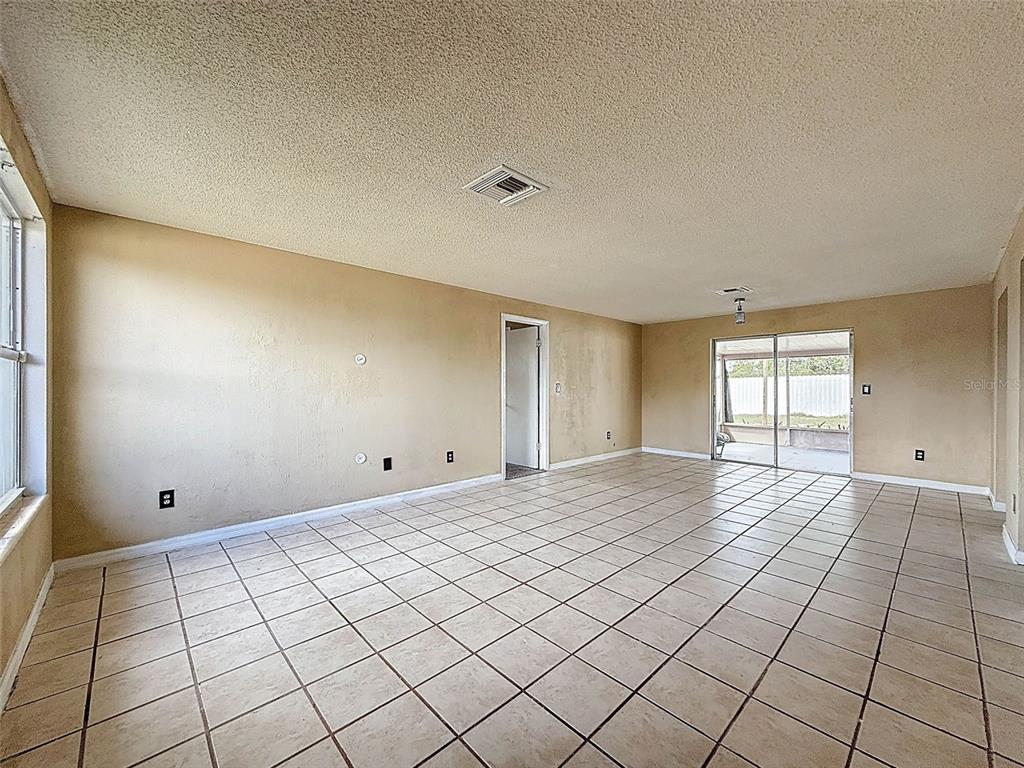 9381 Marler Road Spring Hill, FL 34608 - Photo 6 of 52 a view of an empty room and window
