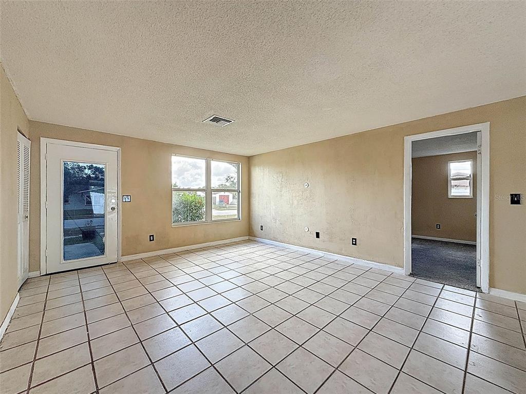9381 Marler Road Spring Hill, FL 34608 - Photo 8 of 52 a view of an empty room and window