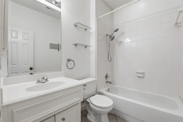 a bathroom with a sink toilet and a bathtub