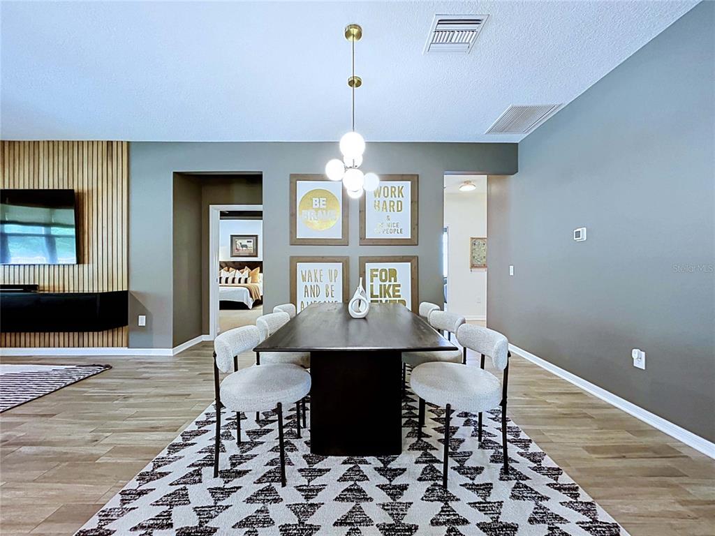 18078 Romanesque Court Spring Hill, FL 34610 - Photo 17 of 81 a dining room with a table and chairs