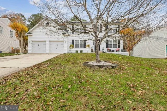 a large tree in front of a house