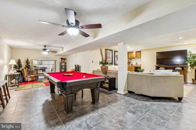 a living room with a flat screen tv and a table