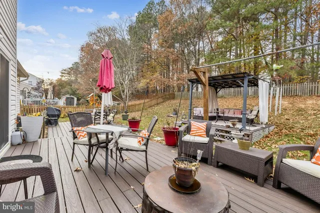 a view of outdoor space with lounge chairs