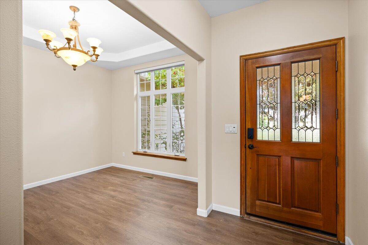 802 Ridgeway Avenue Central Point, OR 97502 - Photo 23 of 33 an empty room with wooden floor fan and windows