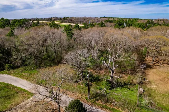 a view of a lake with houses in the background