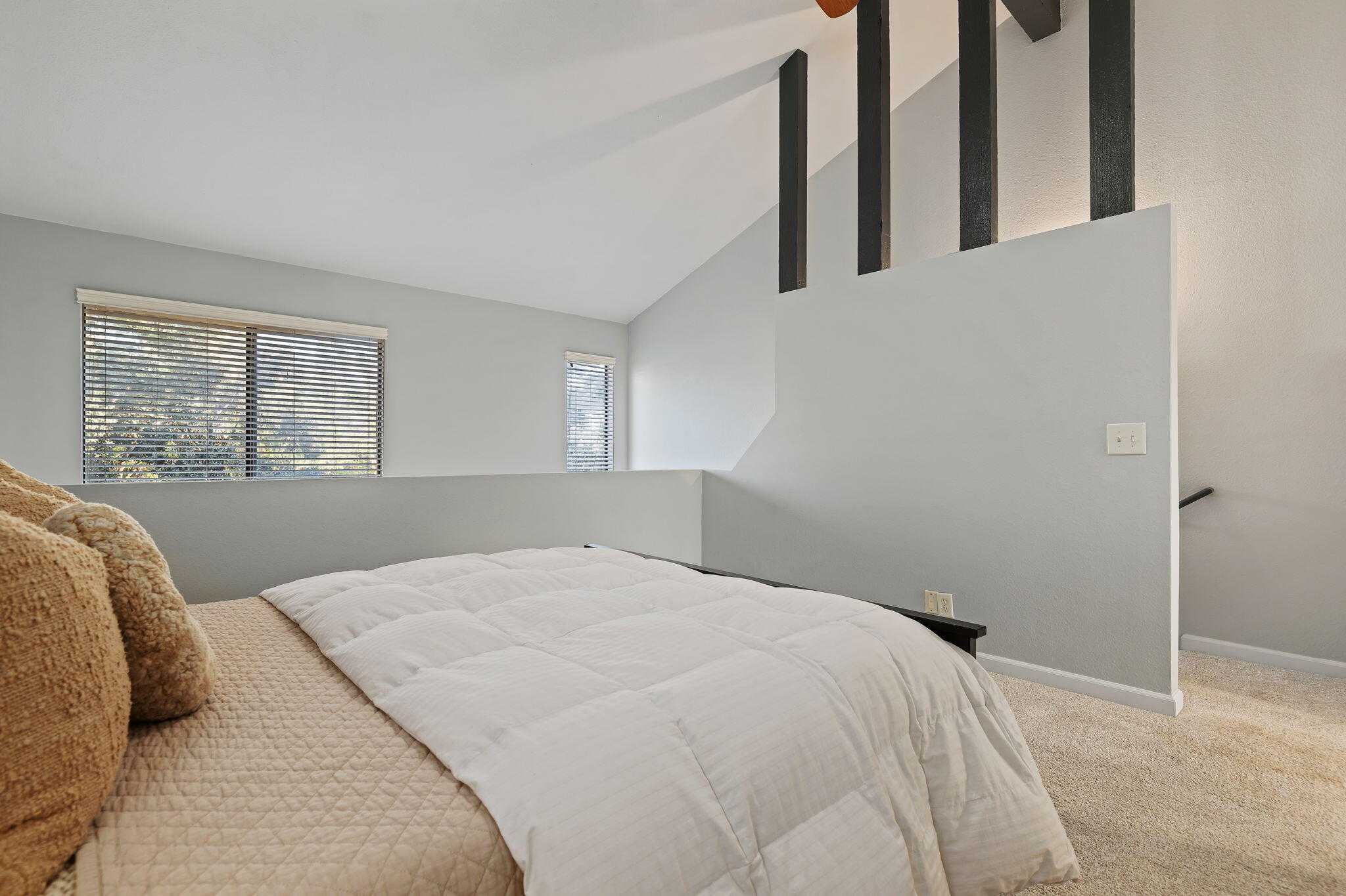 5290 Overpass Road, Unit 10 Goleta, CA 93111 - Photo 12 of 26 a bedroom with a large bed and a window