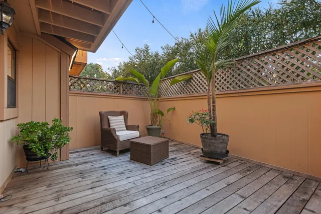 a view of an outdoor space with wooden floor