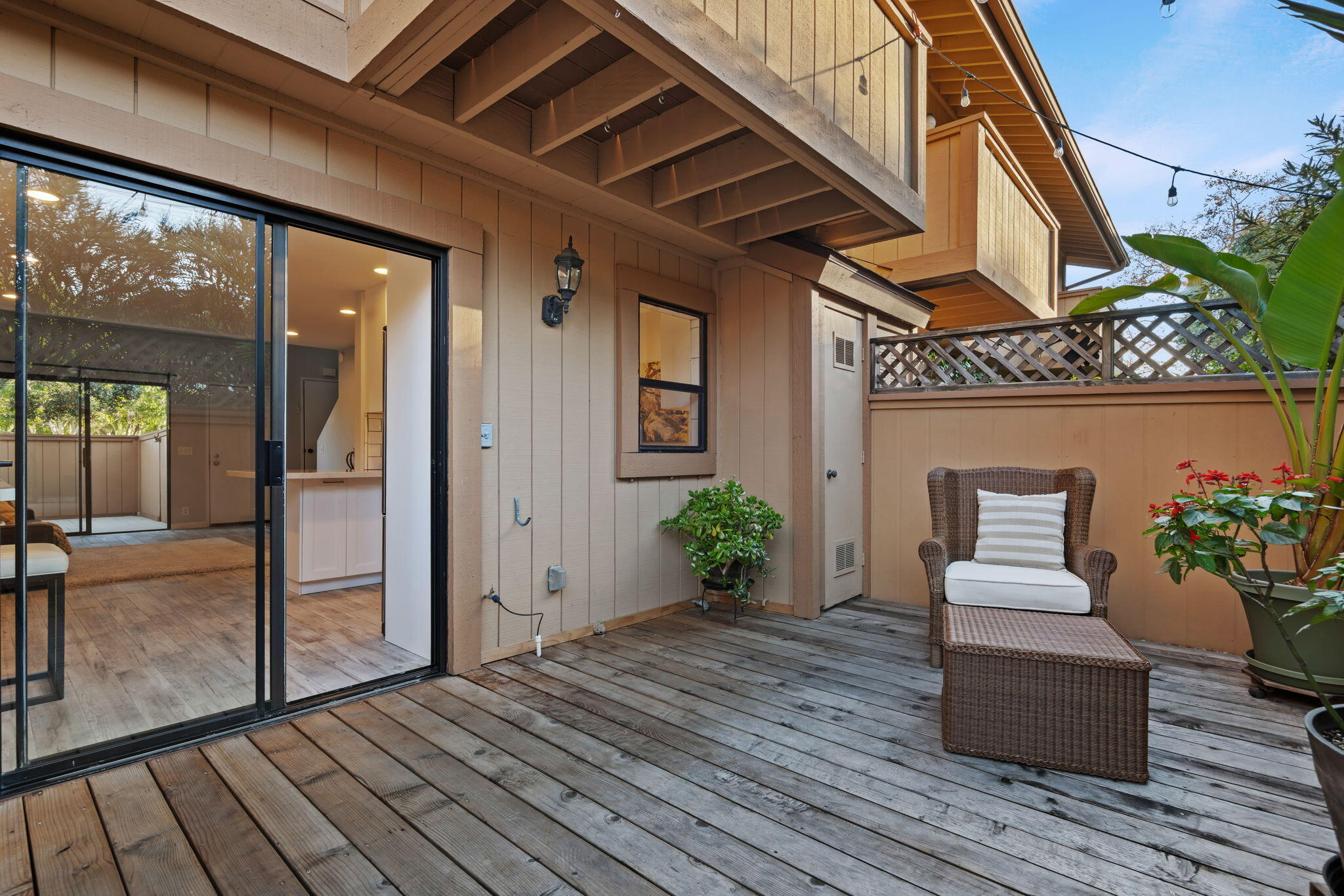 5290 Overpass Road, Unit 10 Goleta, CA 93111 - Photo 21 of 26 a hallway with wooden floor and furniture