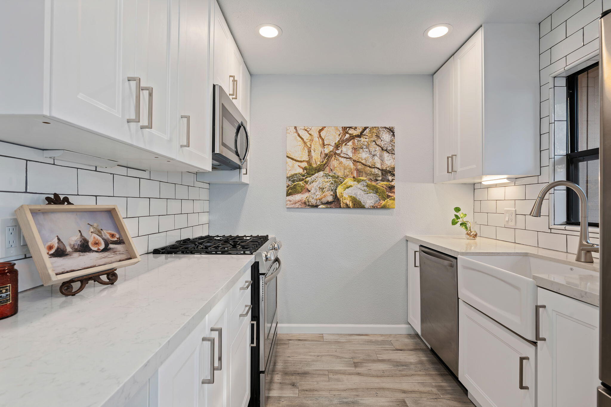 5290 Overpass Road, Unit 10 Goleta, CA 93111 - Photo 6 of 26 a kitchen with a sink a stove and cabinets