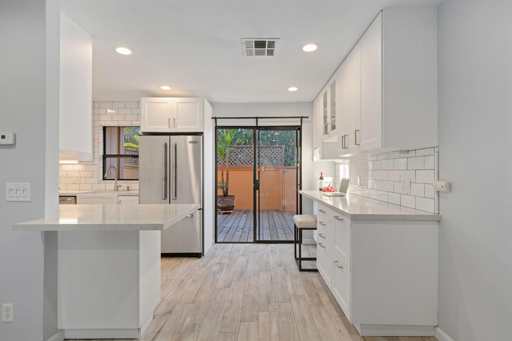 5290 Overpass Road, Unit 10 Goleta, CA 93111 - Photo 7 of 26 a kitchen with stainless steel appliances a sink stove and cabinets