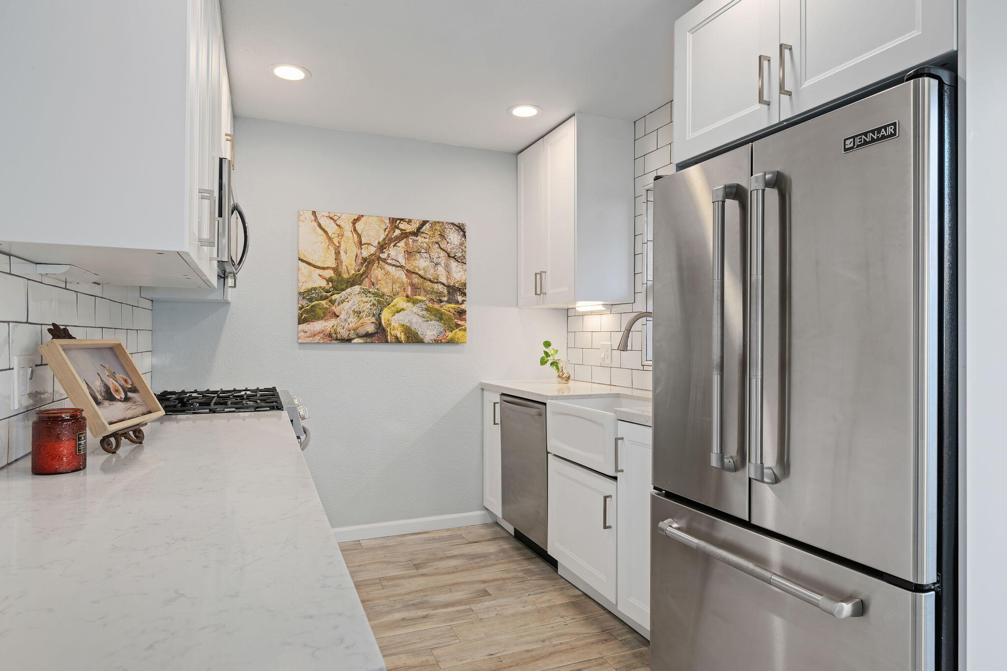5290 Overpass Road, Unit 10 Goleta, CA 93111 - Photo 9 of 26 a kitchen with stainless steel appliances a refrigerator and a stove top oven