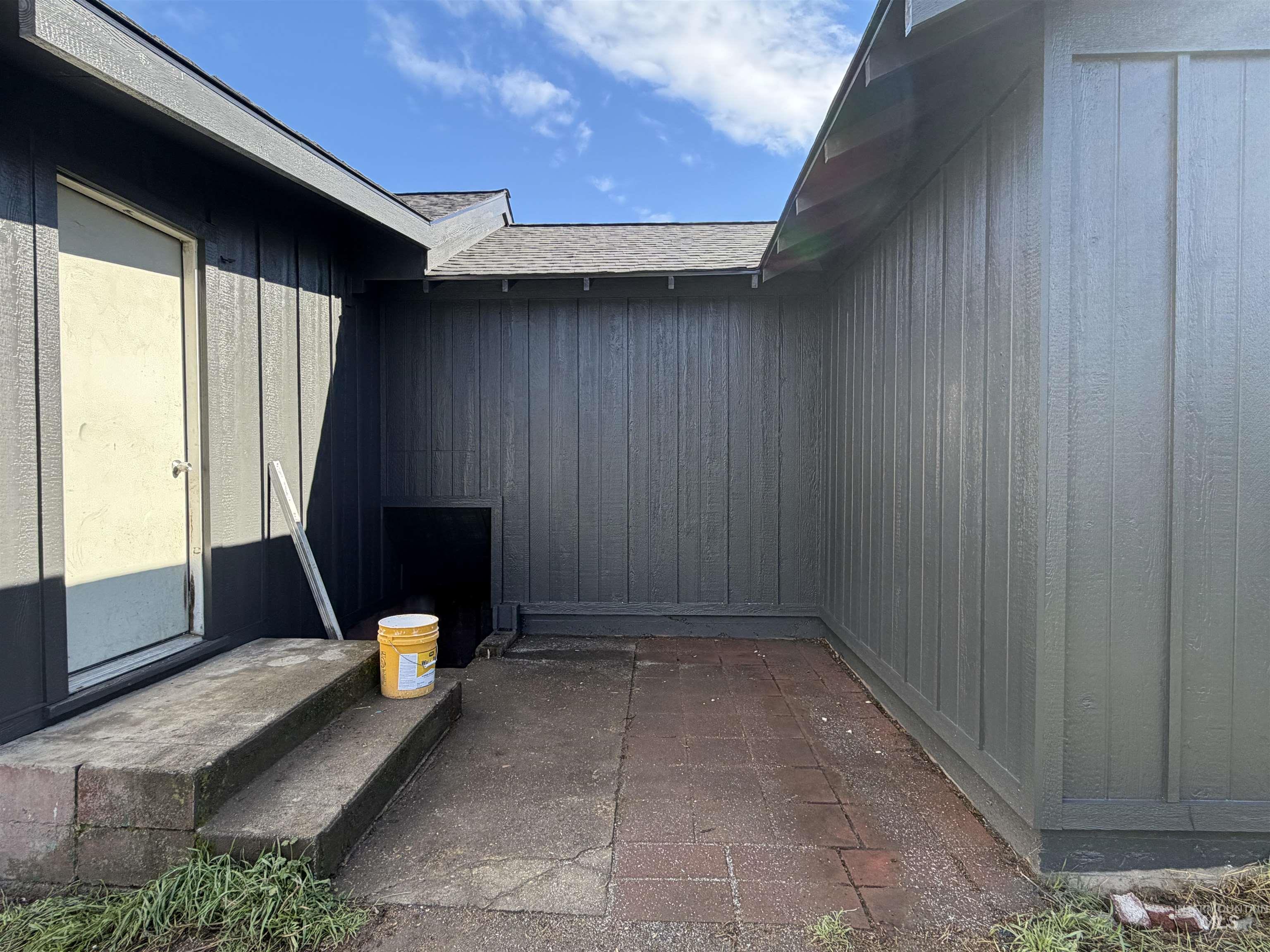 600 11th Street Clarkston, WA 99403 - Photo 11 of 27 View of exterior entry featuring a patio and roof with shingles