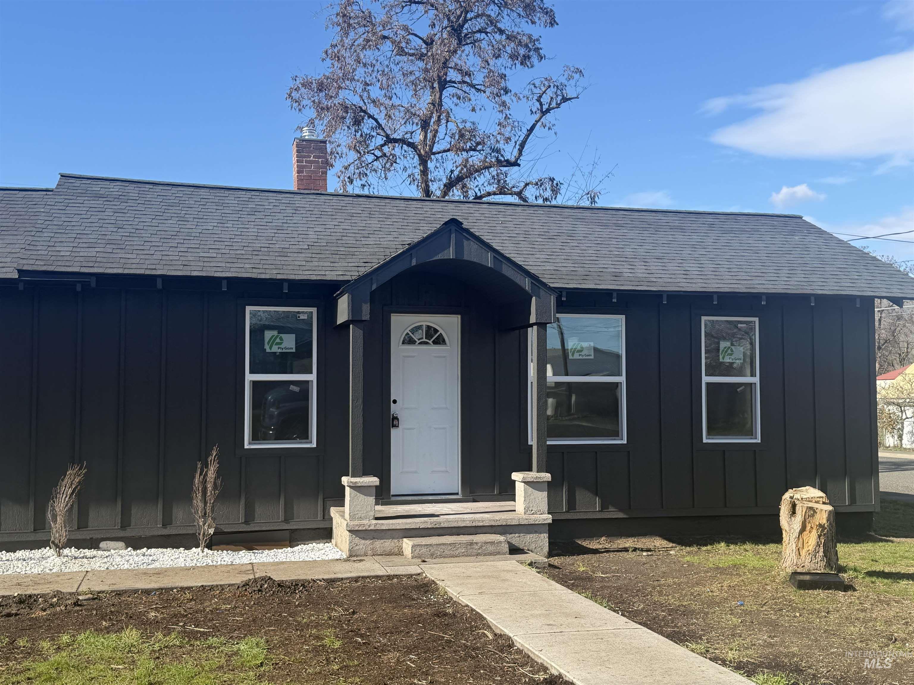 600 11th Street Clarkston, WA 99403 - Photo 2 of 27 View of front of property with board and batten siding, a shingled roof, and a chimney