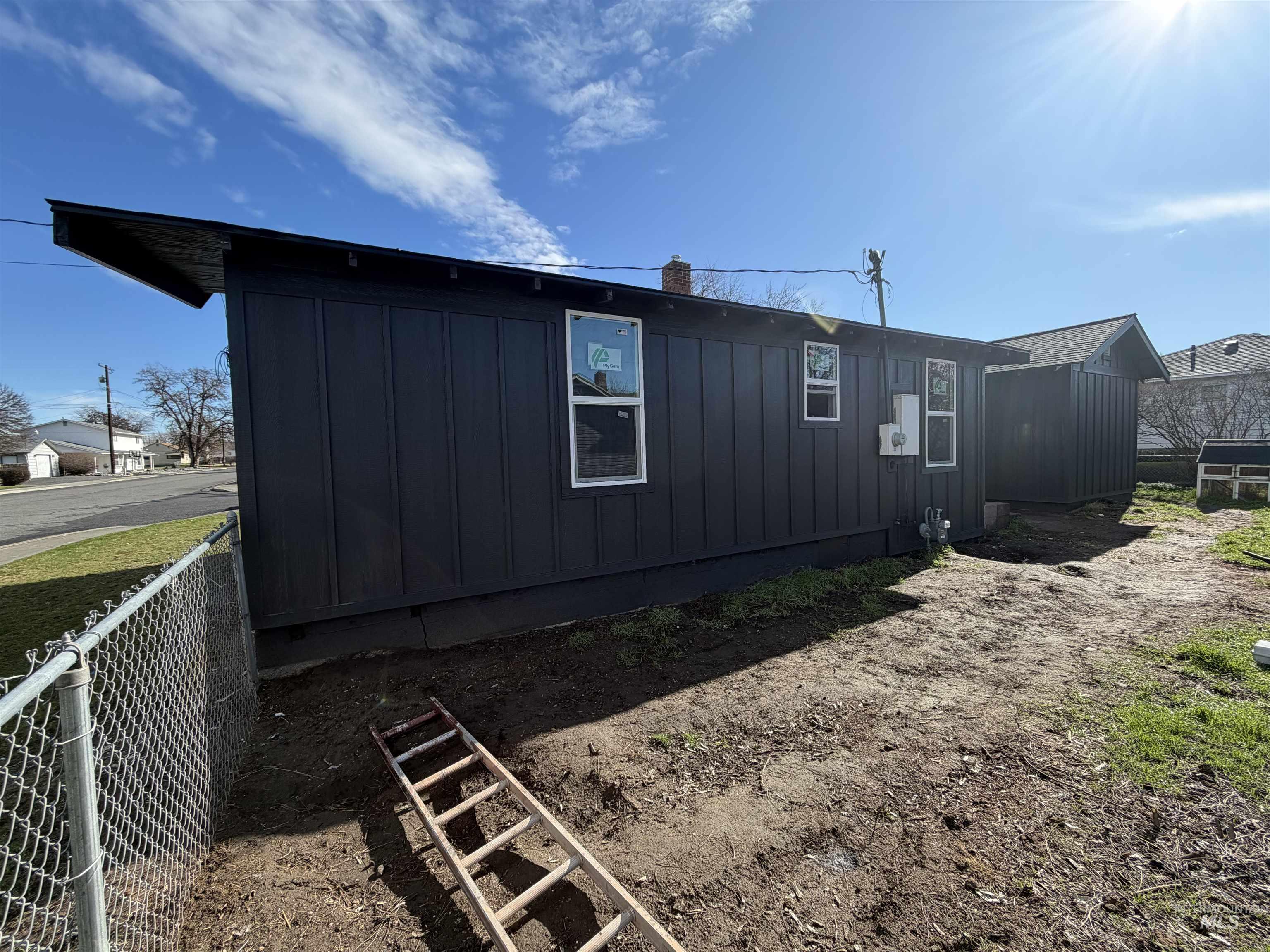 600 11th Street Clarkston, WA 99403 - Photo 10 of 27 View of home's exterior with board and batten siding and a chimney