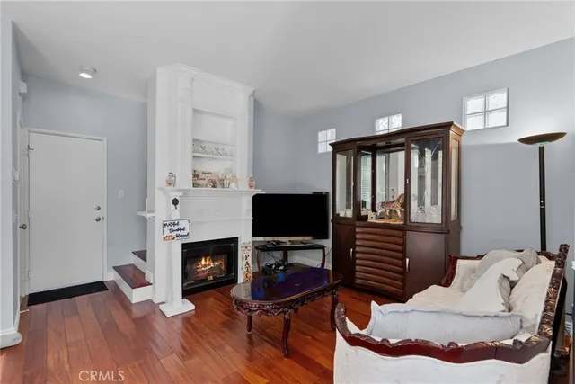 a bedroom with furniture and a fireplace