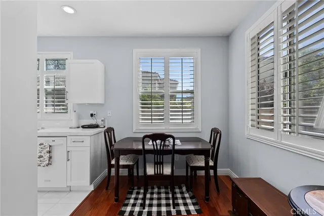 a view of a a dining room with furniture window and outside view
