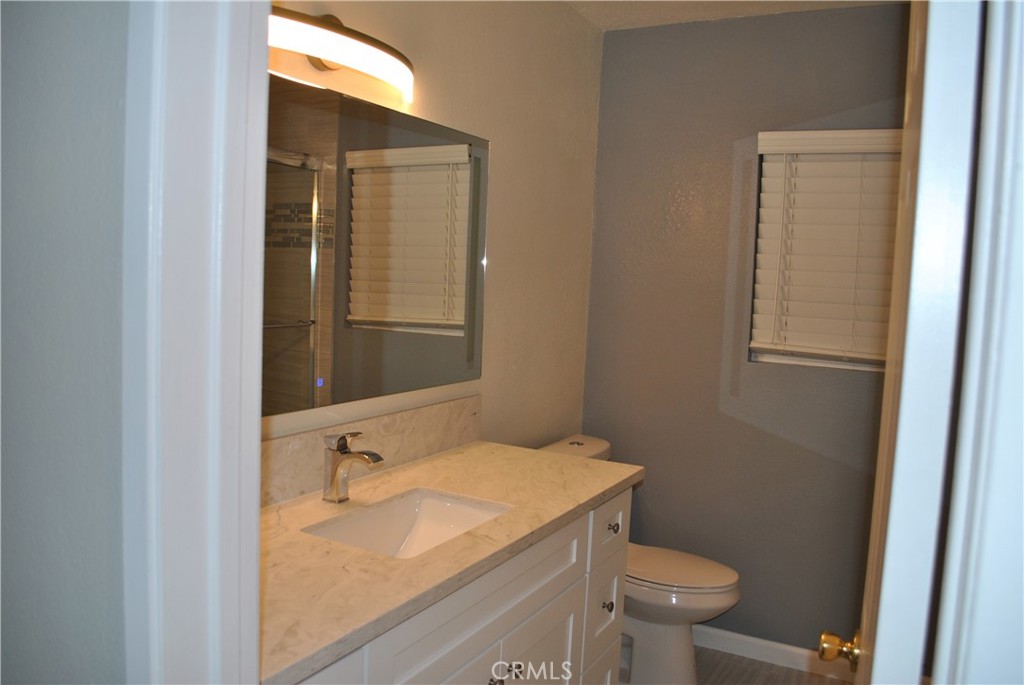 620 Stephen Road Burbank, CA 91504 - Photo 13 of 15 a bathroom with a granite countertop sink toilet and shower