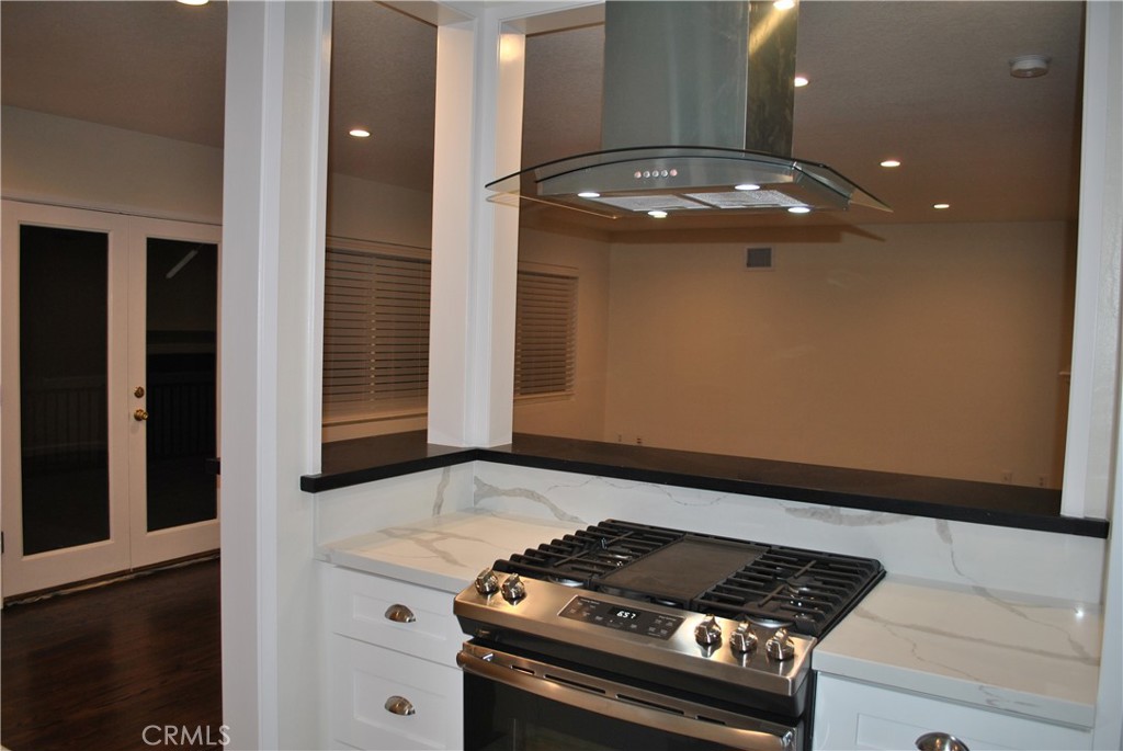 620 Stephen Road Burbank, CA 91504 - Photo 7 of 15 a stove top oven sitting inside of a kitchen