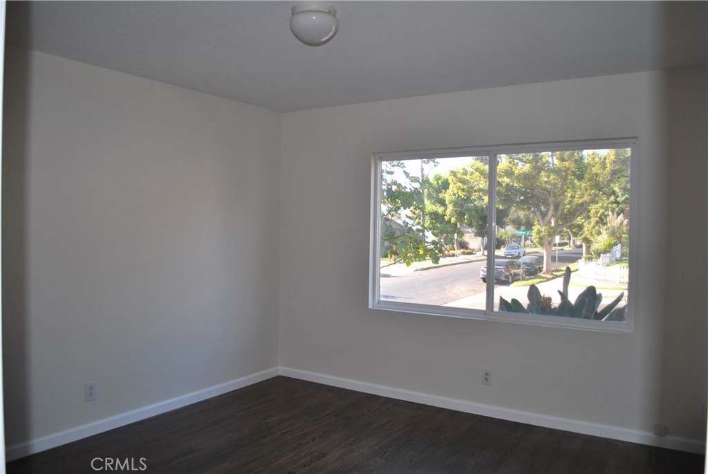 620 Stephen Road Burbank, CA 91504 - Photo 9 of 15 a window in an empty room with wooden floor