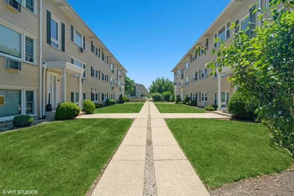 a view of a building with a yard