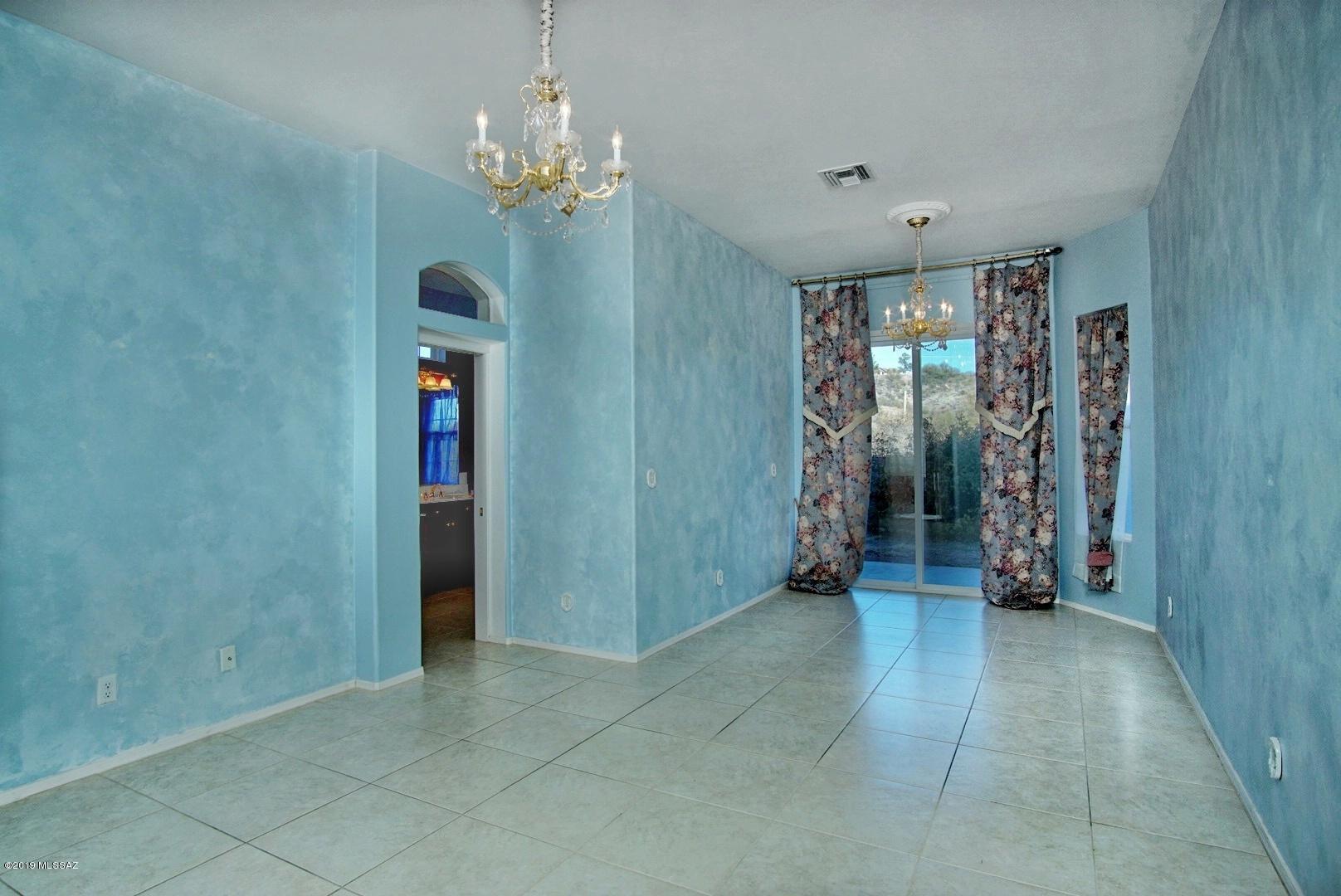 1137 Avenida Seville Rio Rico, AZ 85648 - Photo 9 of 19 a view of a hallway with closet and chandelier