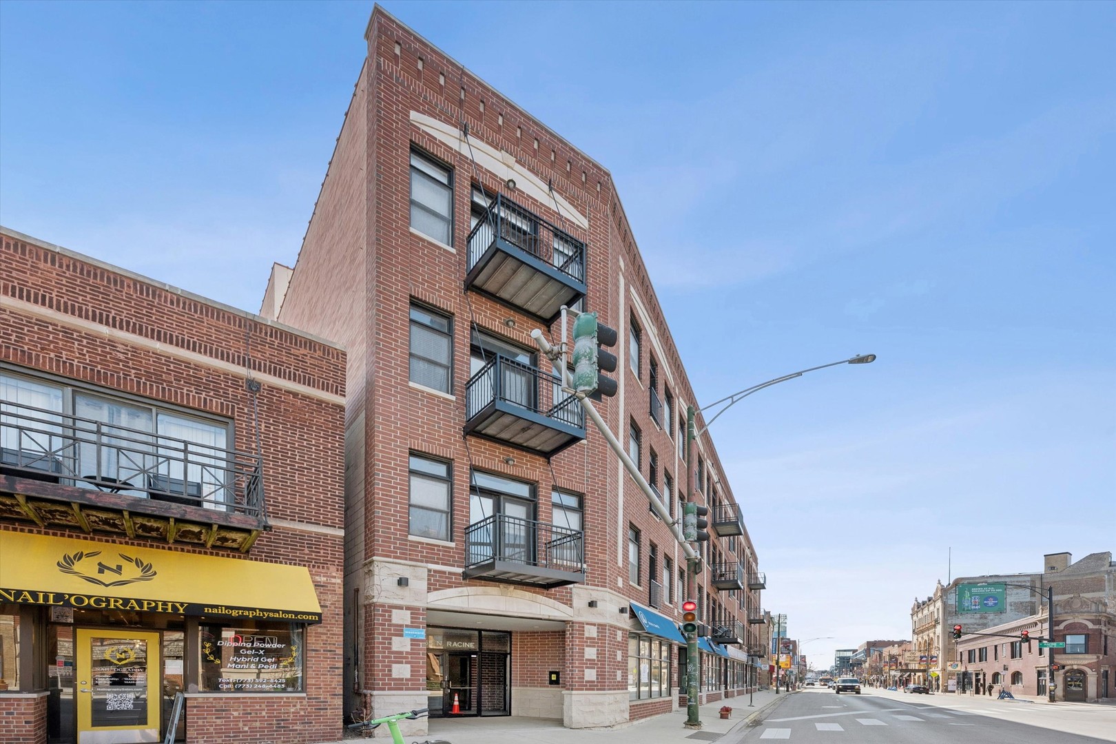 3755 North Racine Avenue, Unit 3C Chicago, IL 60613 - Photo 1 of 36 a view of a building with a street