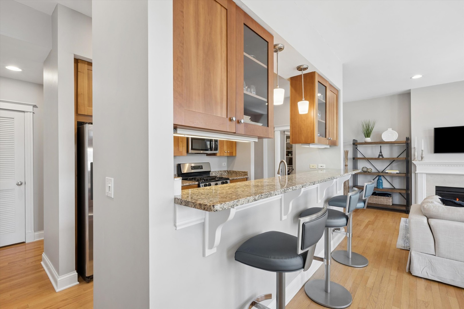 3755 North Racine Avenue, Unit 3C Chicago, IL 60613 - Photo 11 of 36 a kitchen with stainless steel appliances granite countertop a sink and cabinets
