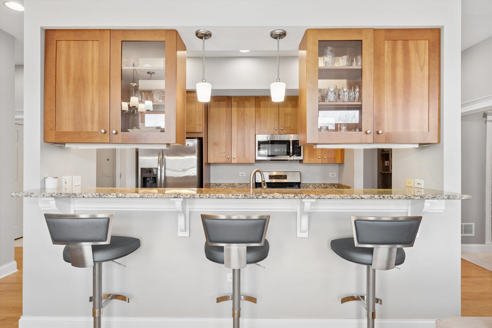 3755 North Racine Avenue, Unit 3C Chicago, IL 60613 - Photo 12 of 36 a kitchen with stainless steel appliances a stove a sink and cabinets