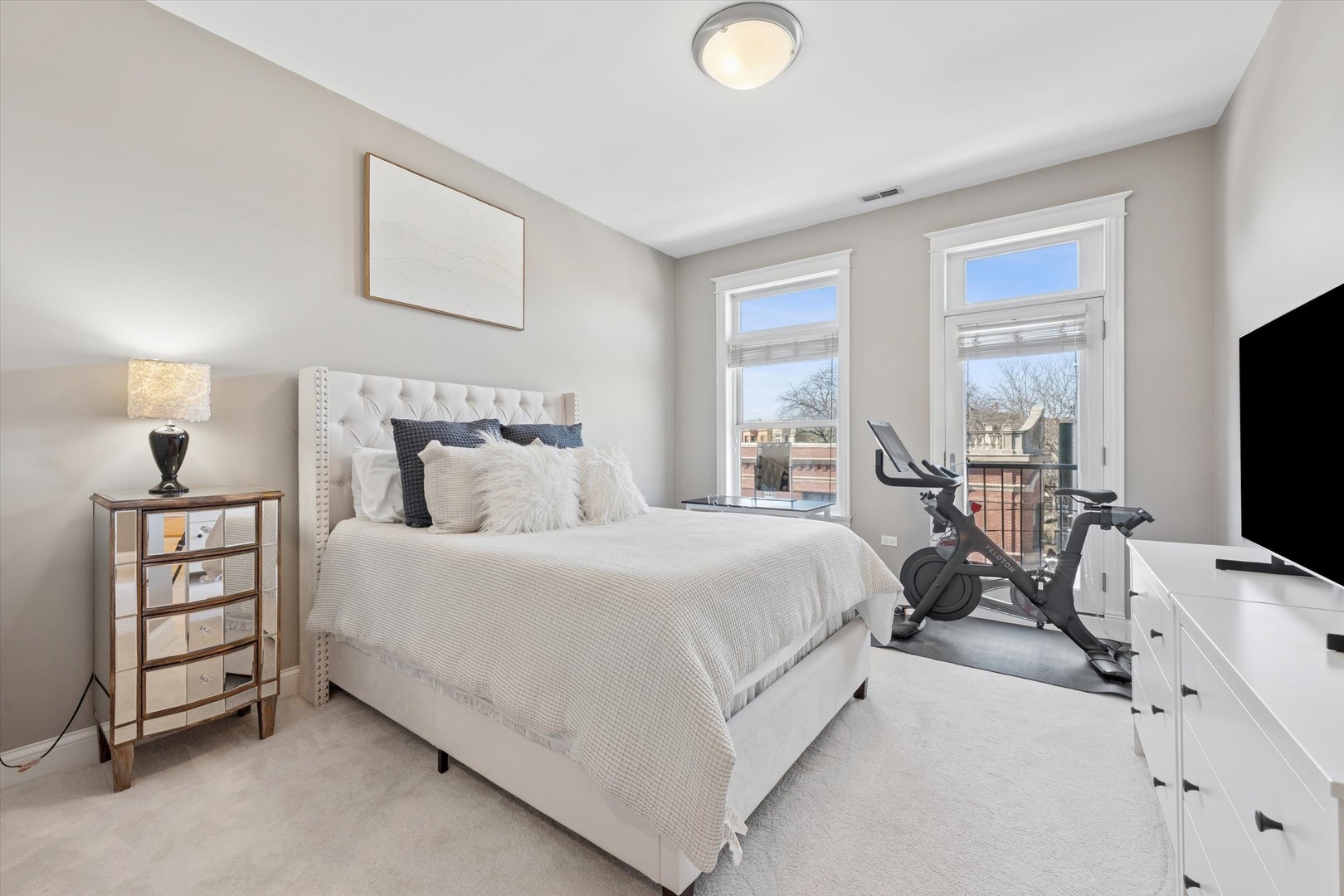 3755 North Racine Avenue, Unit 3C Chicago, IL 60613 - Photo 17 of 36 a bed room with a bed and a tv