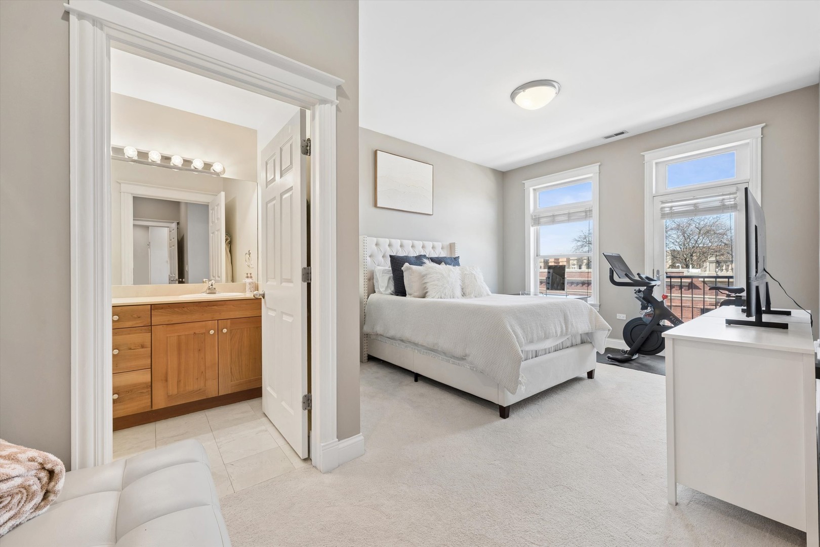 3755 North Racine Avenue, Unit 3C Chicago, IL 60613 - Photo 18 of 36 a bedroom with a bed and a view of kitchen