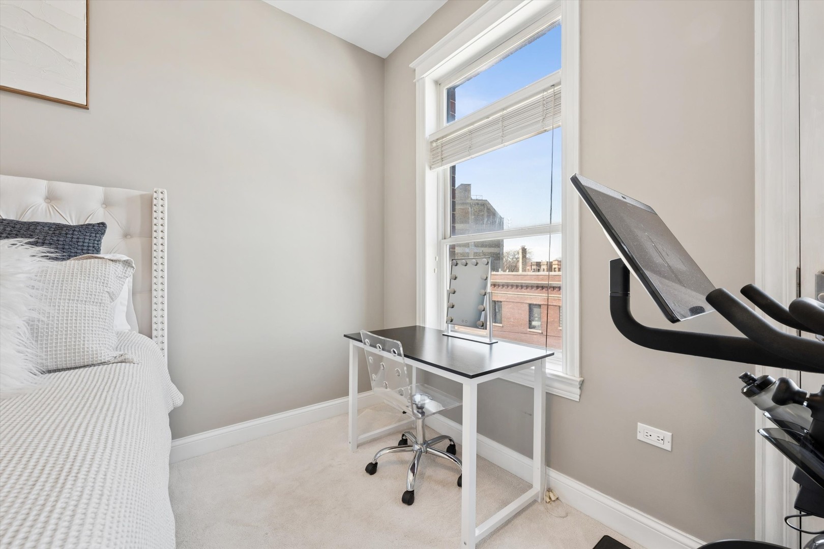 3755 North Racine Avenue, Unit 3C Chicago, IL 60613 - Photo 19 of 36 a bathroom with a sink a mirror and a window