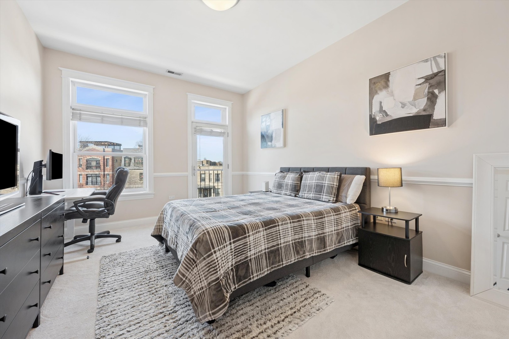 3755 North Racine Avenue, Unit 3C Chicago, IL 60613 - Photo 24 of 36 a bedroom with a bed and a table