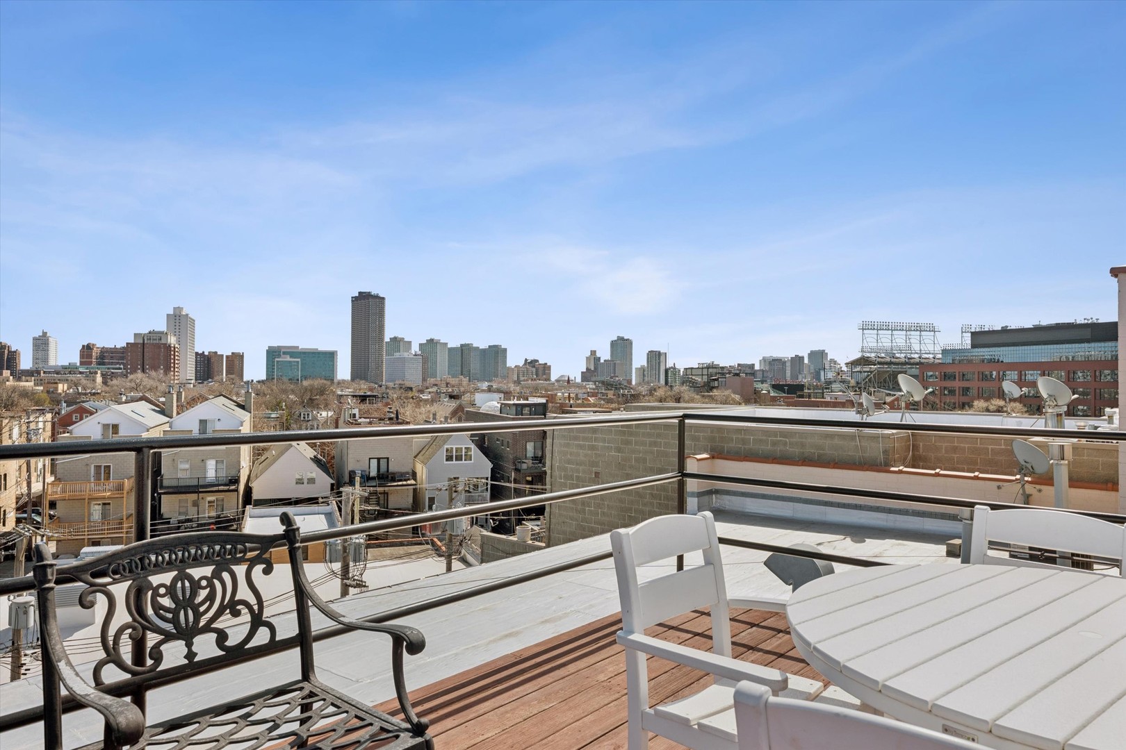 3755 North Racine Avenue, Unit 3C Chicago, IL 60613 - Photo 31 of 36 a view of a terrace with chairs