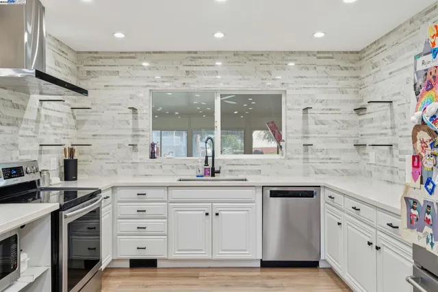 a kitchen with a table and chairs in it