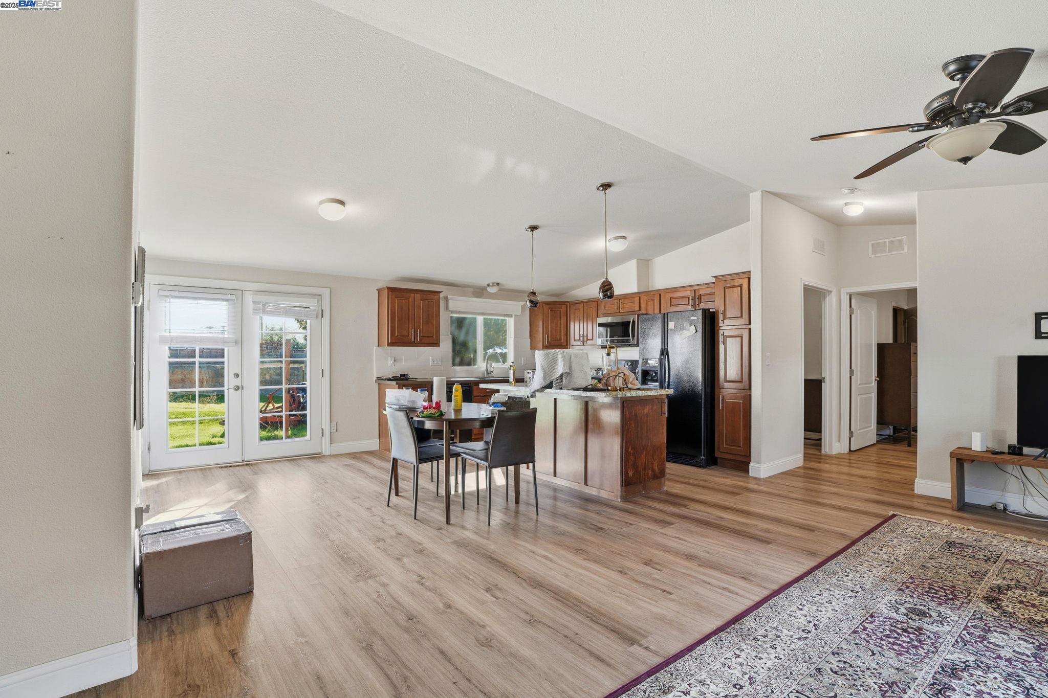 34724 Bernard Road Tracy, CA 95377 - Photo 21 of 60 a view of a dining room with furniture window and wooden floor