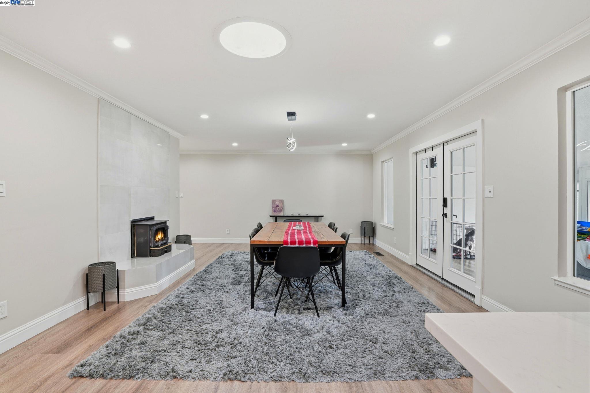 34724 Bernard Road Tracy, CA 95377 - Photo 23 of 60 a living room with furniture a table and kitchen view