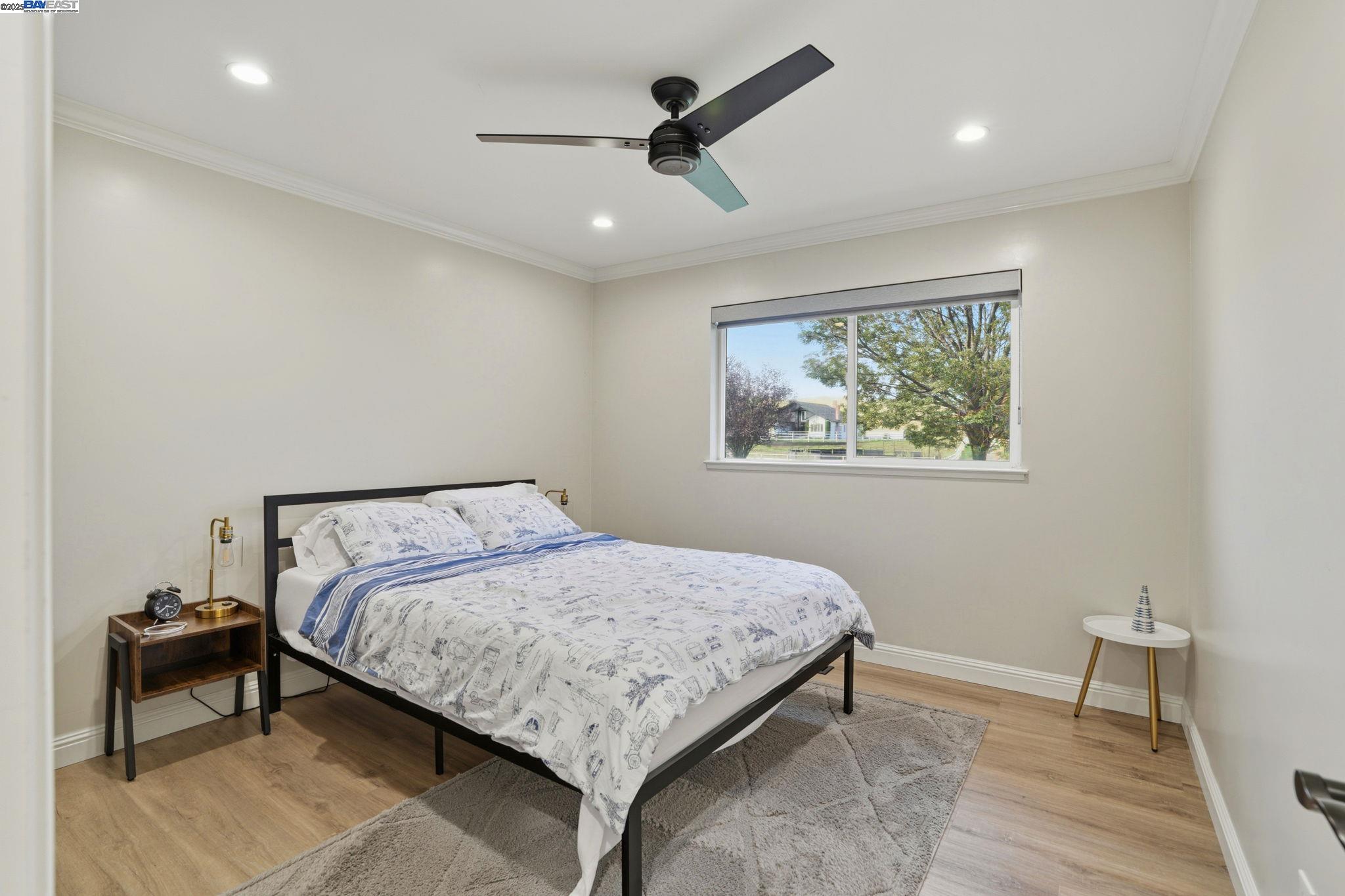 34724 Bernard Road Tracy, CA 95377 - Photo 27 of 60 a bedroom with a bed and a painting on the wall