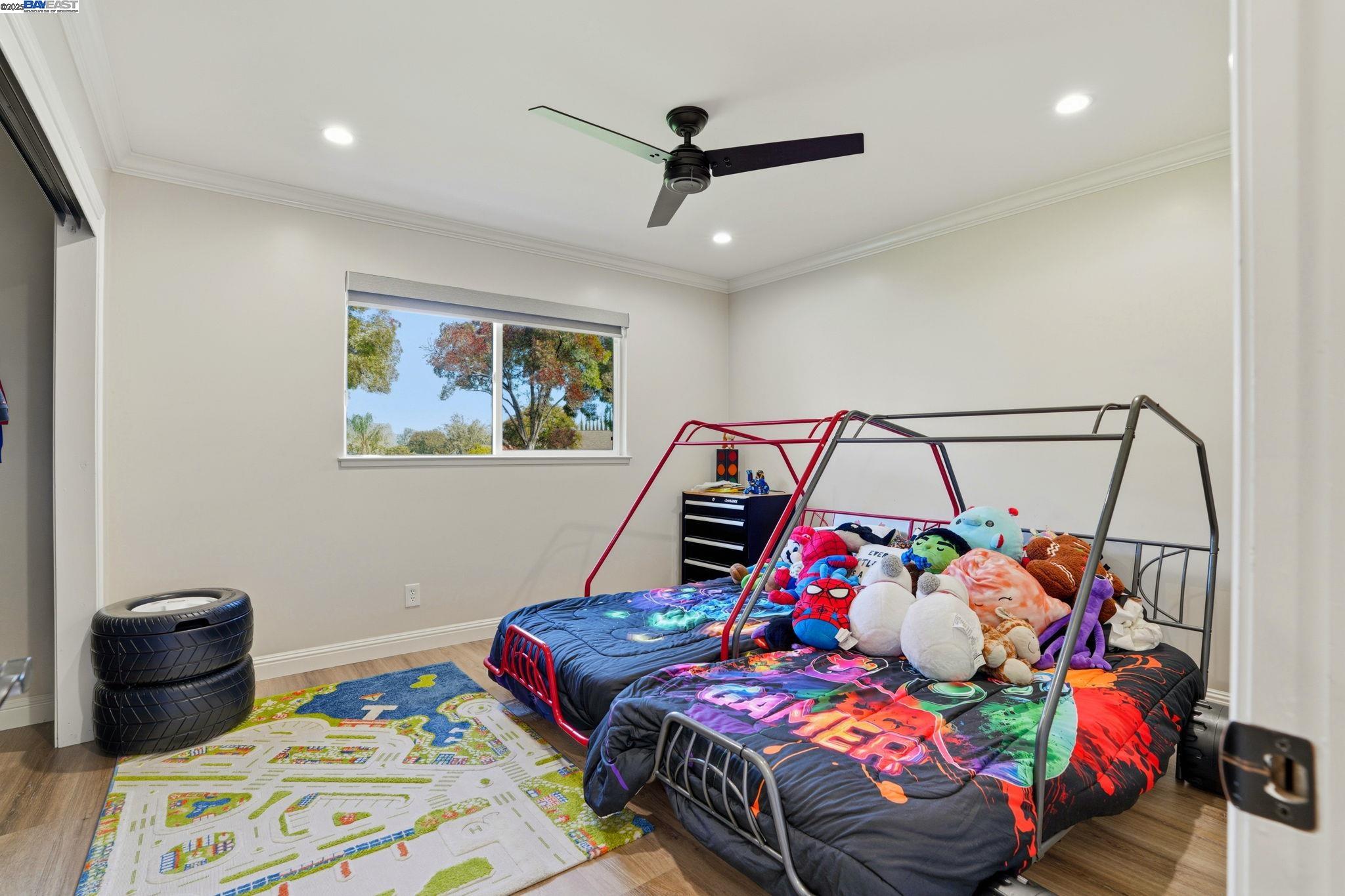 34724 Bernard Road Tracy, CA 95377 - Photo 30 of 60 a bedroom with a bed a dresser and a potted plant