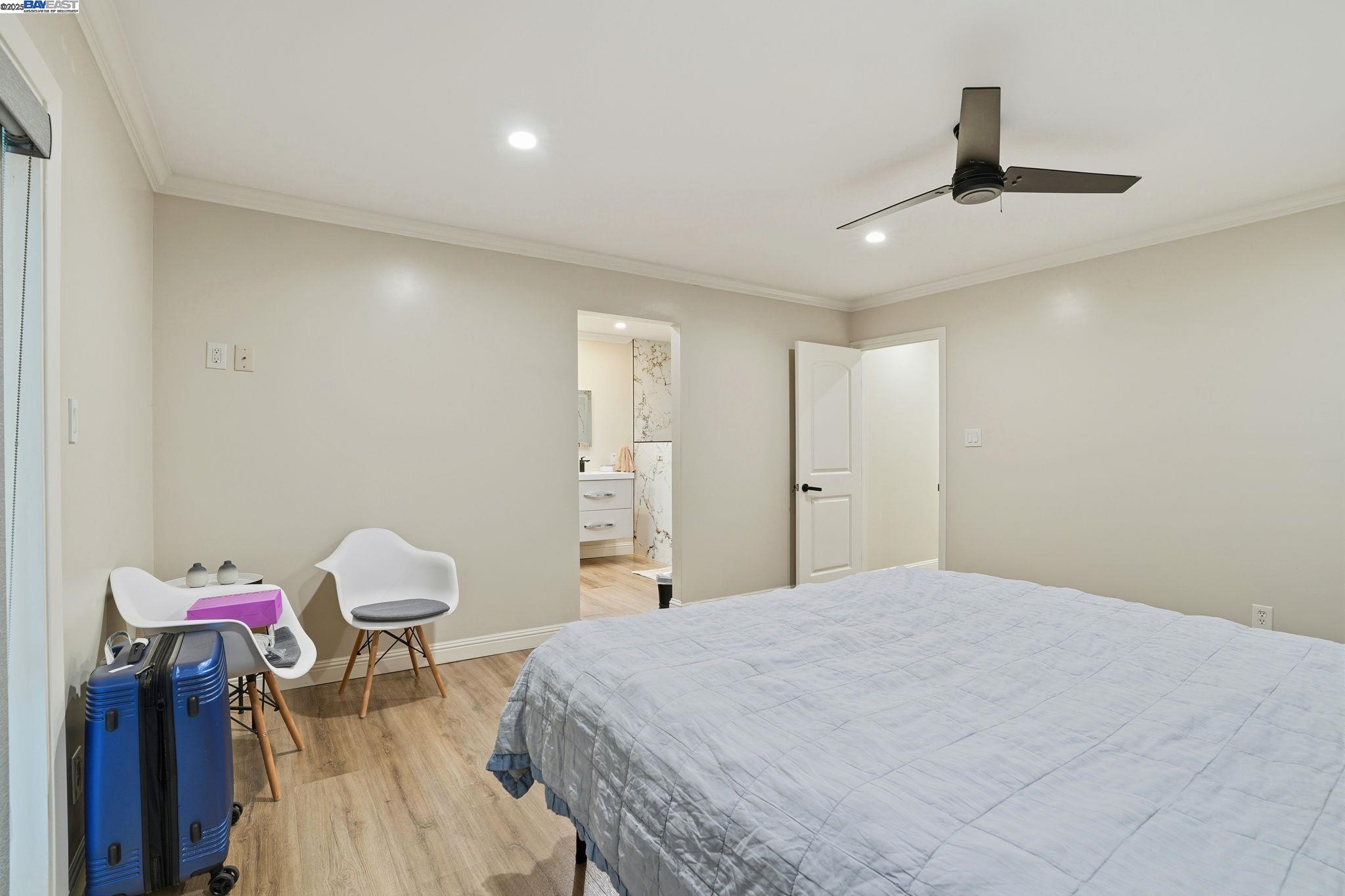 34724 Bernard Road Tracy, CA 95377 - Photo 32 of 60 a bedroom with a bed and a chandelier