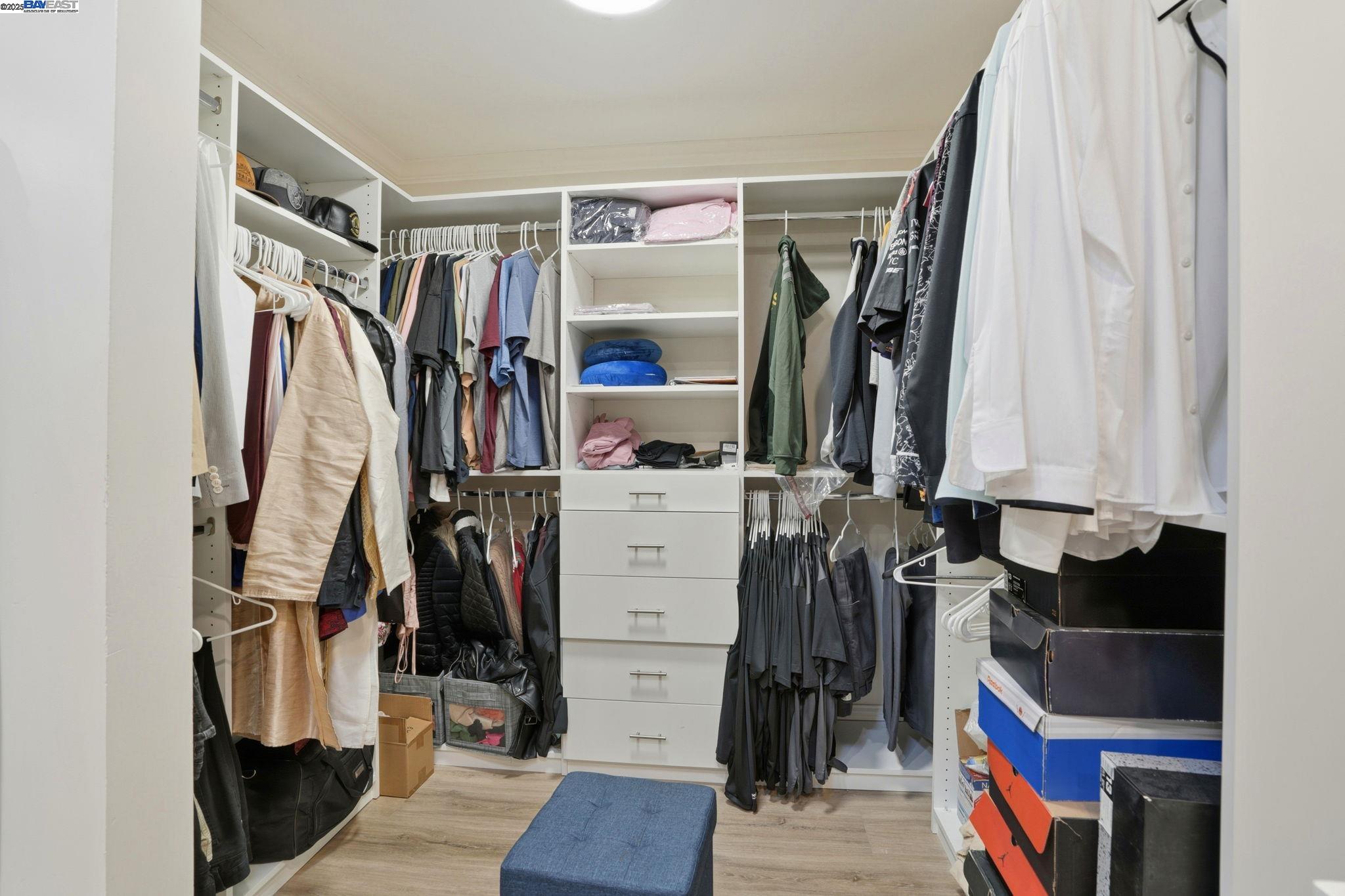34724 Bernard Road Tracy, CA 95377 - Photo 37 of 60 a view of walk in closet with clothes and shoes