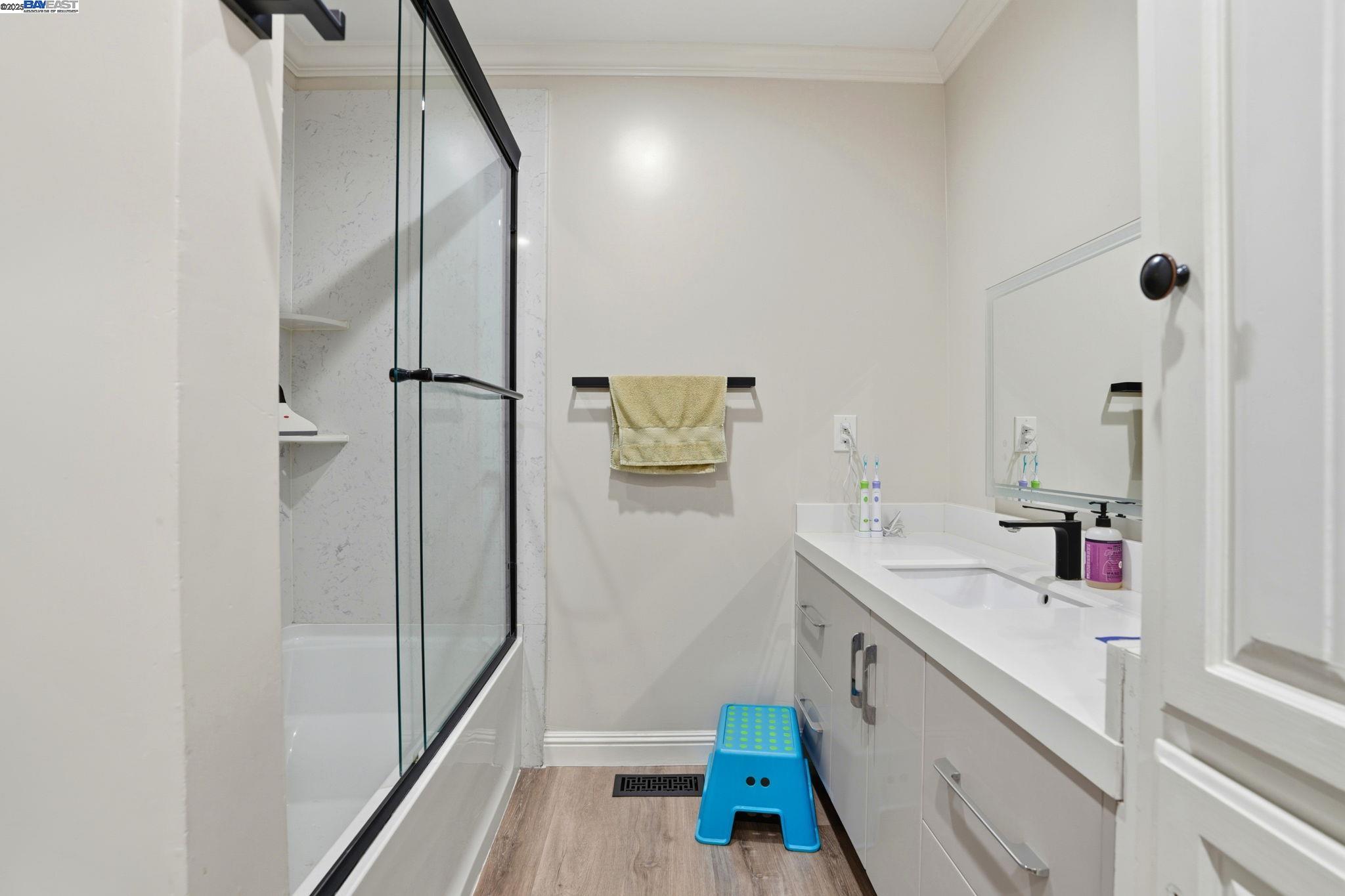 34724 Bernard Road Tracy, CA 95377 - Photo 38 of 60 a bathroom with a tub sink and mirror