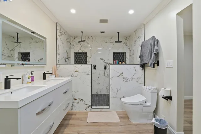 a utility room with sink dryer and washer