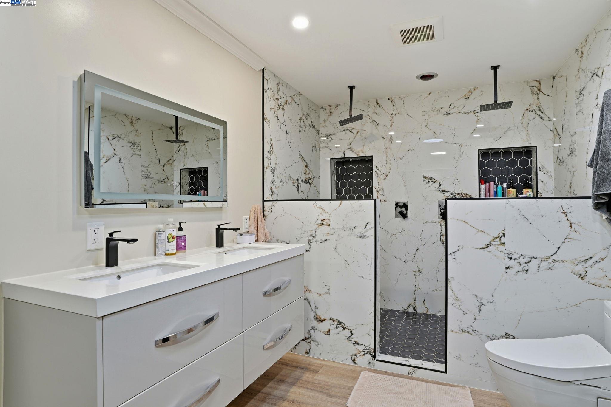 34724 Bernard Road Tracy, CA 95377 - Photo 40 of 60 a bathroom with a double vanity sink mirror and toilet