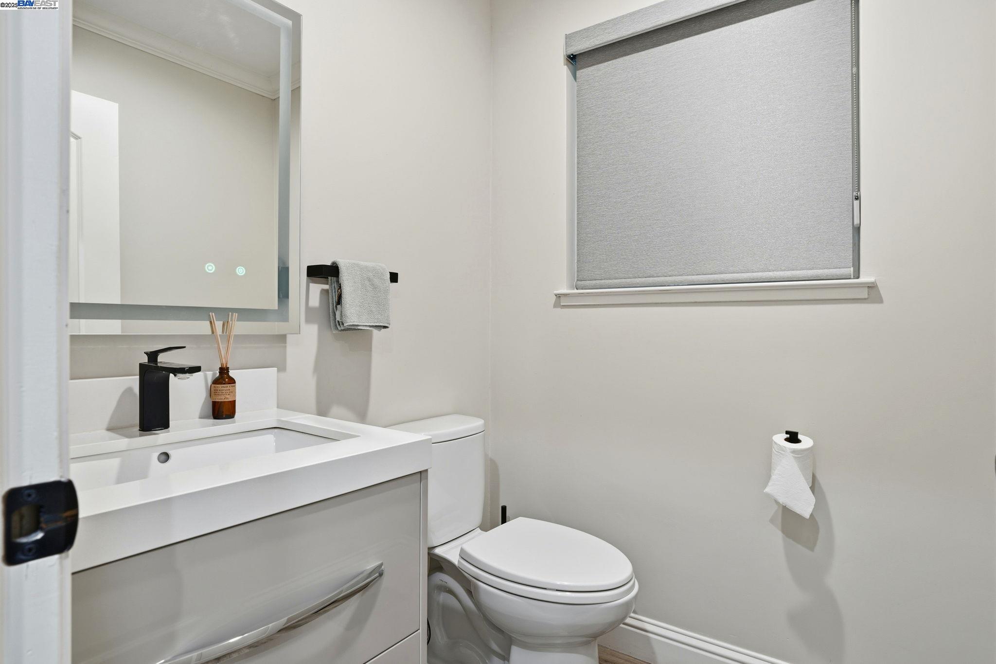 34724 Bernard Road Tracy, CA 95377 - Photo 41 of 60 a bathroom with a sink toilet and mirror