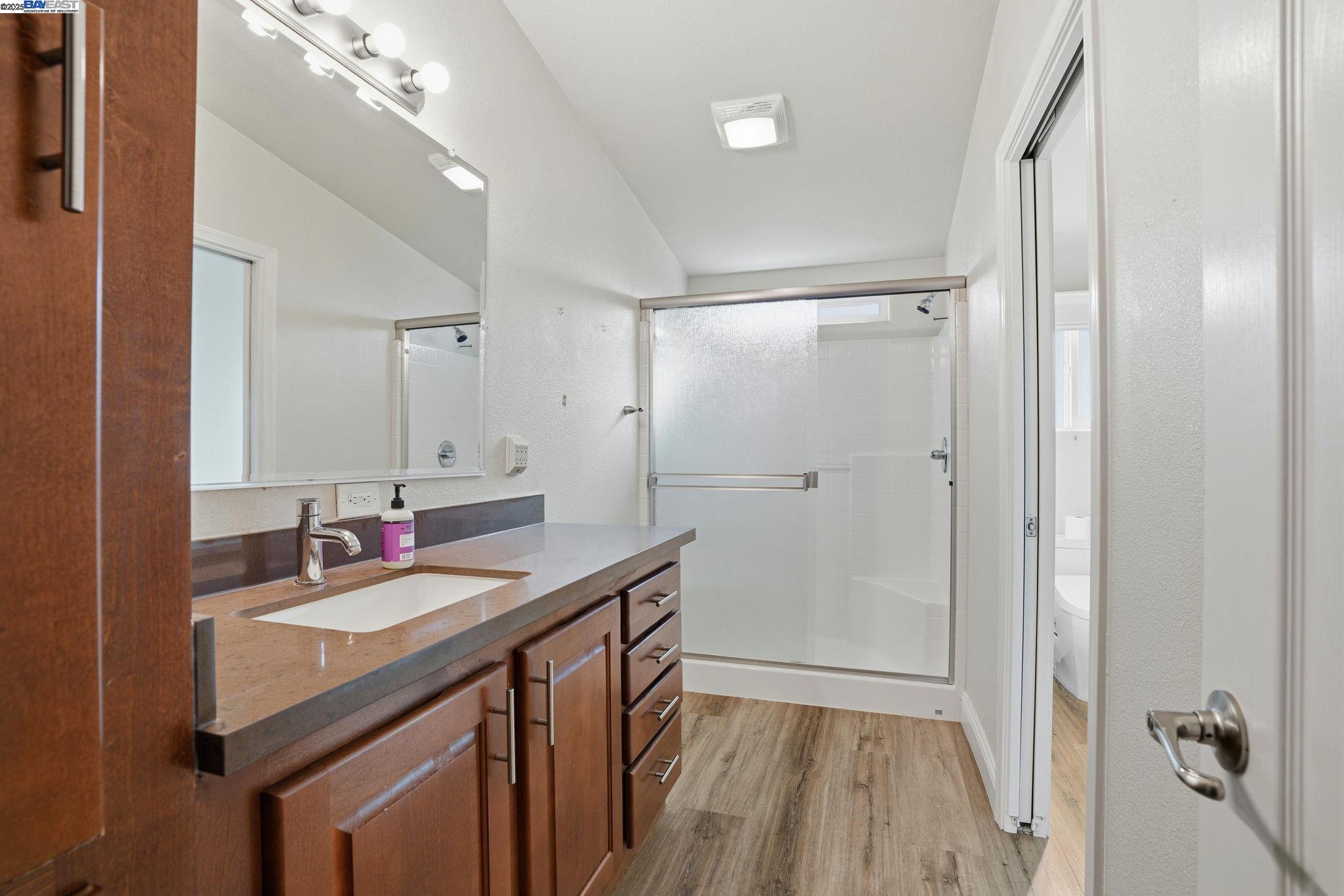 34724 Bernard Road Tracy, CA 95377 - Photo 42 of 60 a bathroom with a sink double vanity and a mirror