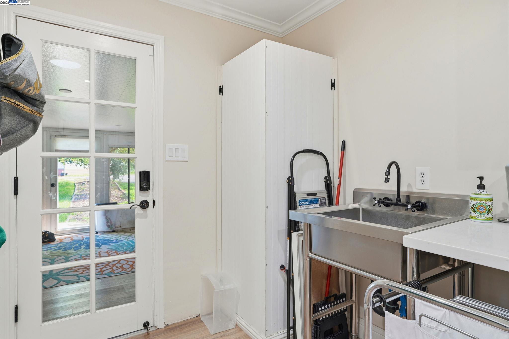 34724 Bernard Road Tracy, CA 95377 - Photo 44 of 60 a kitchen with a sink and cabinets