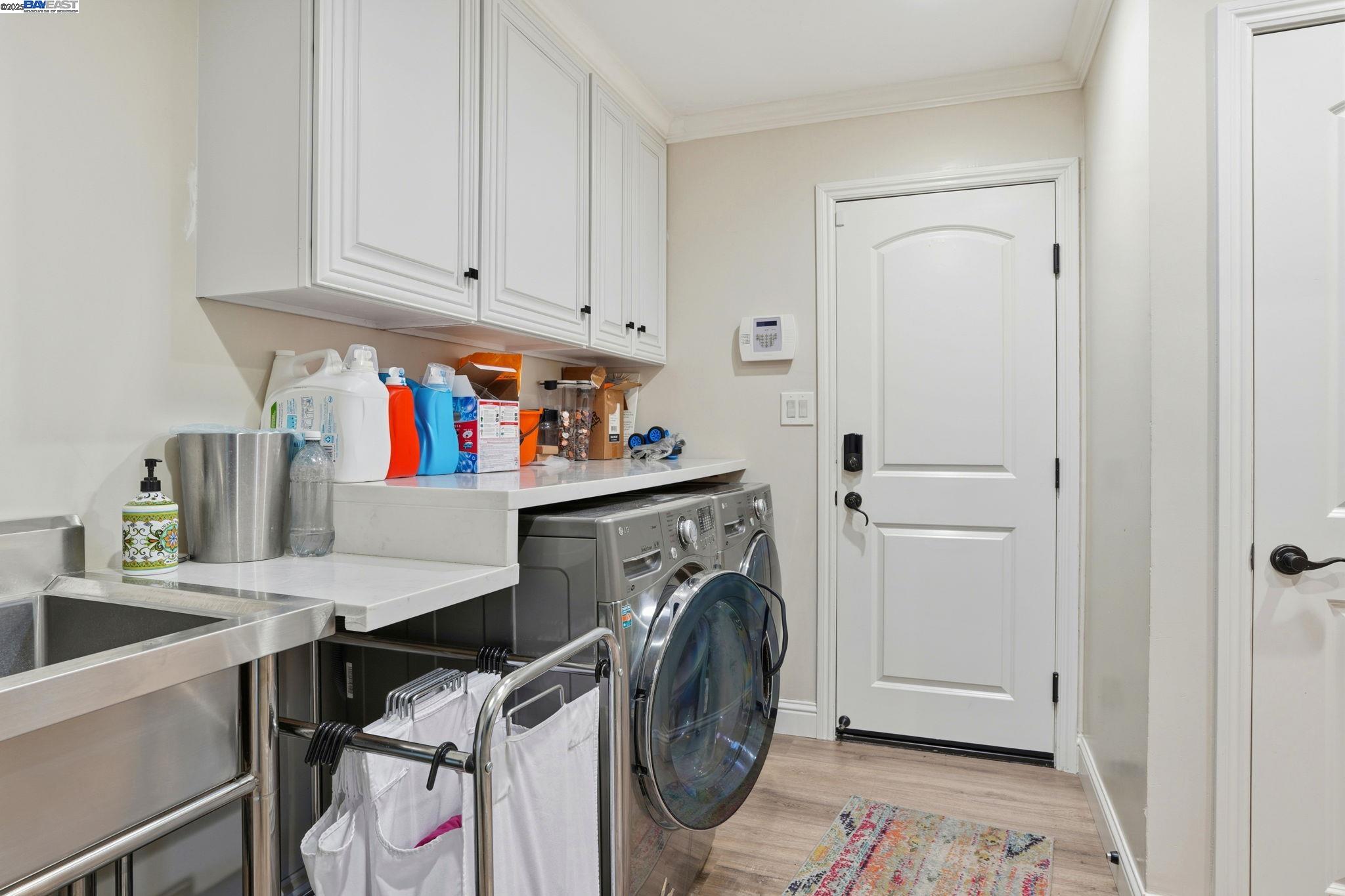 34724 Bernard Road Tracy, CA 95377 - Photo 45 of 60 a utility room with sink dryer and washer