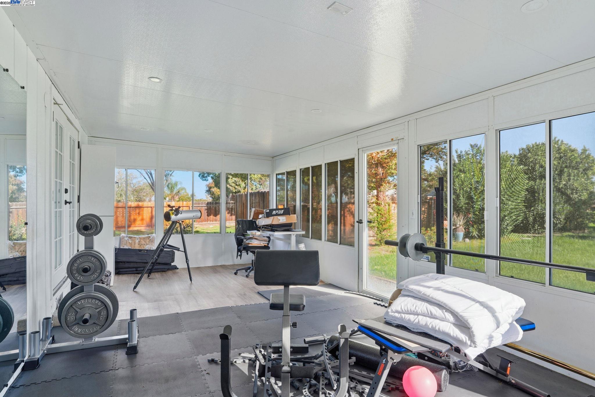 34724 Bernard Road Tracy, CA 95377 - Photo 47 of 60 a living room with furniture tv and large windows