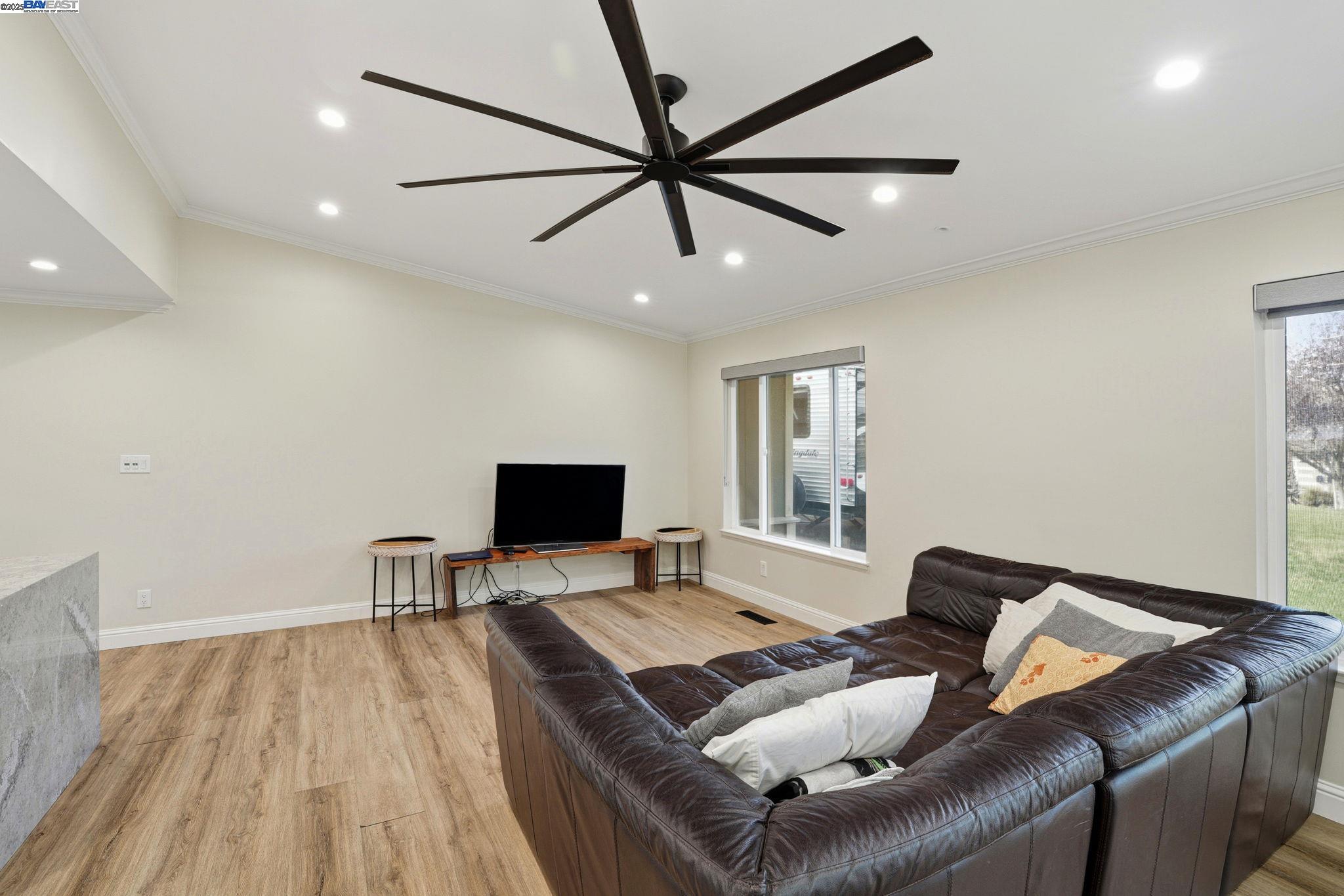 34724 Bernard Road Tracy, CA 95377 - Photo 10 of 60 a living room with furniture and a flat screen tv